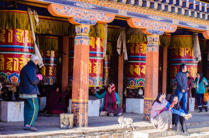I loved the juxtaposition of the old  and the new at the Chorten - the older religious people praying and the young girls  looking at their tablet.